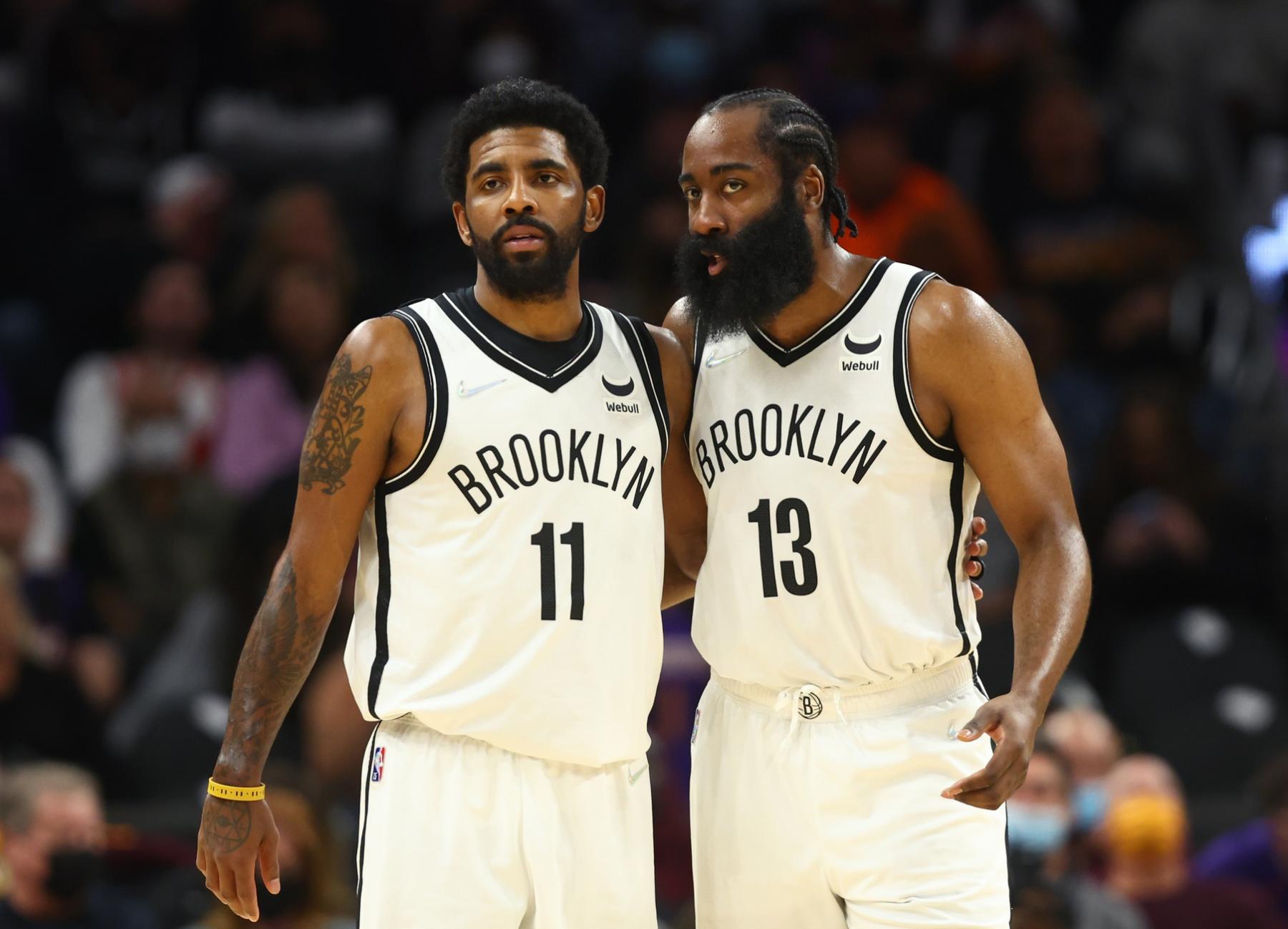 Brooklyn Nets guard Kyrie Irving (11) and guard James Harden (13) against the Phoenix Suns at Footprint Center. Mandatory Credit: Mark J. Rebilas-USA TODAY Sports