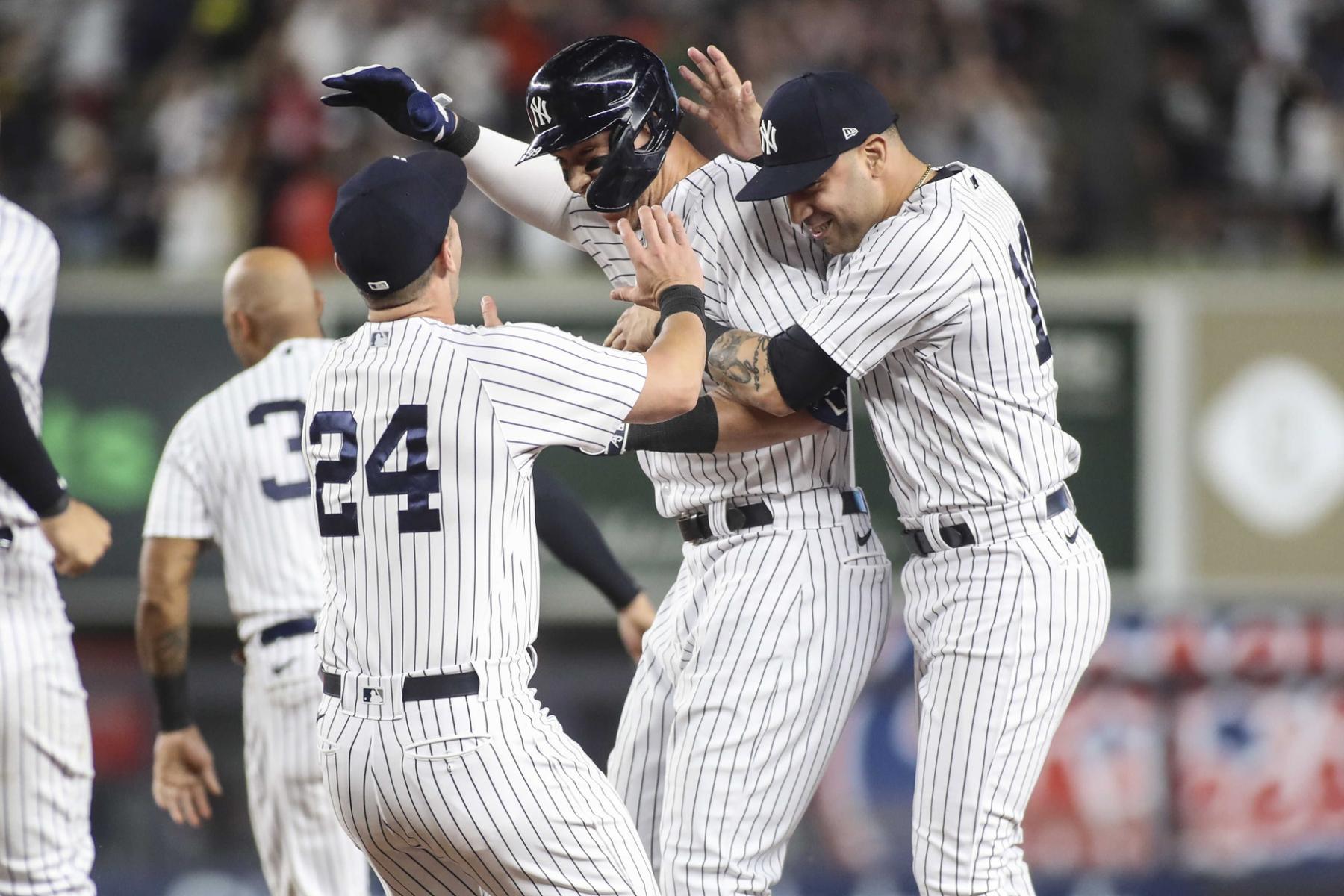 New York Yankees center fielder Aaron Judge (99) celebrates after hitting a game winning RBI single in the ninth inning to defeat the Houston Astros 7-6 at Yankee Stadium. Mandatory Credit: Wendell Cruz-USA TODAY Sports