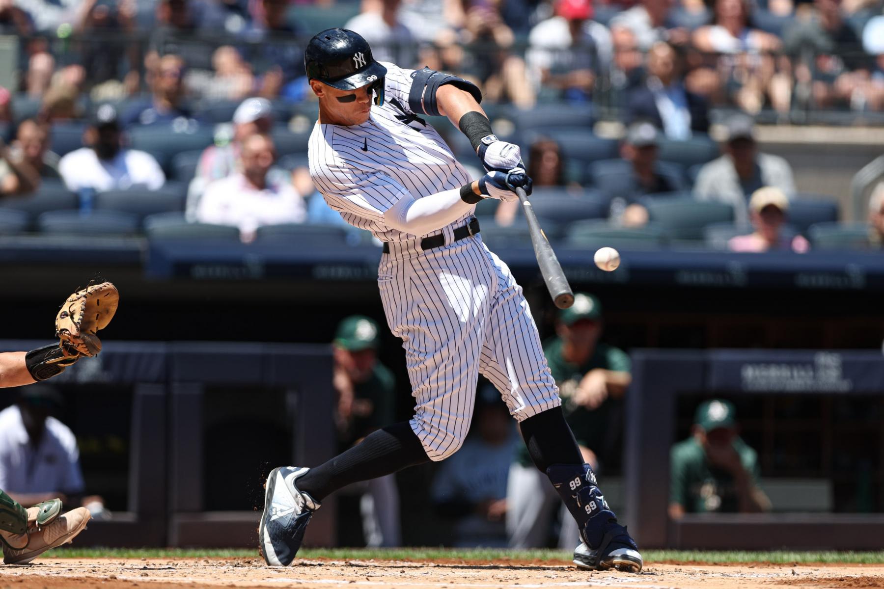 Aaron Judge (99) hits a two-run home run during the first inning against the Oakland Athletics at Yankee Stadium. Mandatory Credit: Vincent Carchietta-USA TODAY Sports