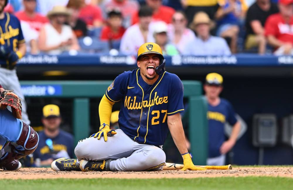 Milwaukee Brewers' Freddy Peralta poses for a picture with a